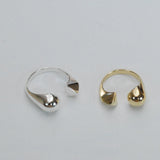 Photo of silver and bronze split shank rings with pyramid and sphere