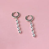 Silver huggie hoops with bubbly charms