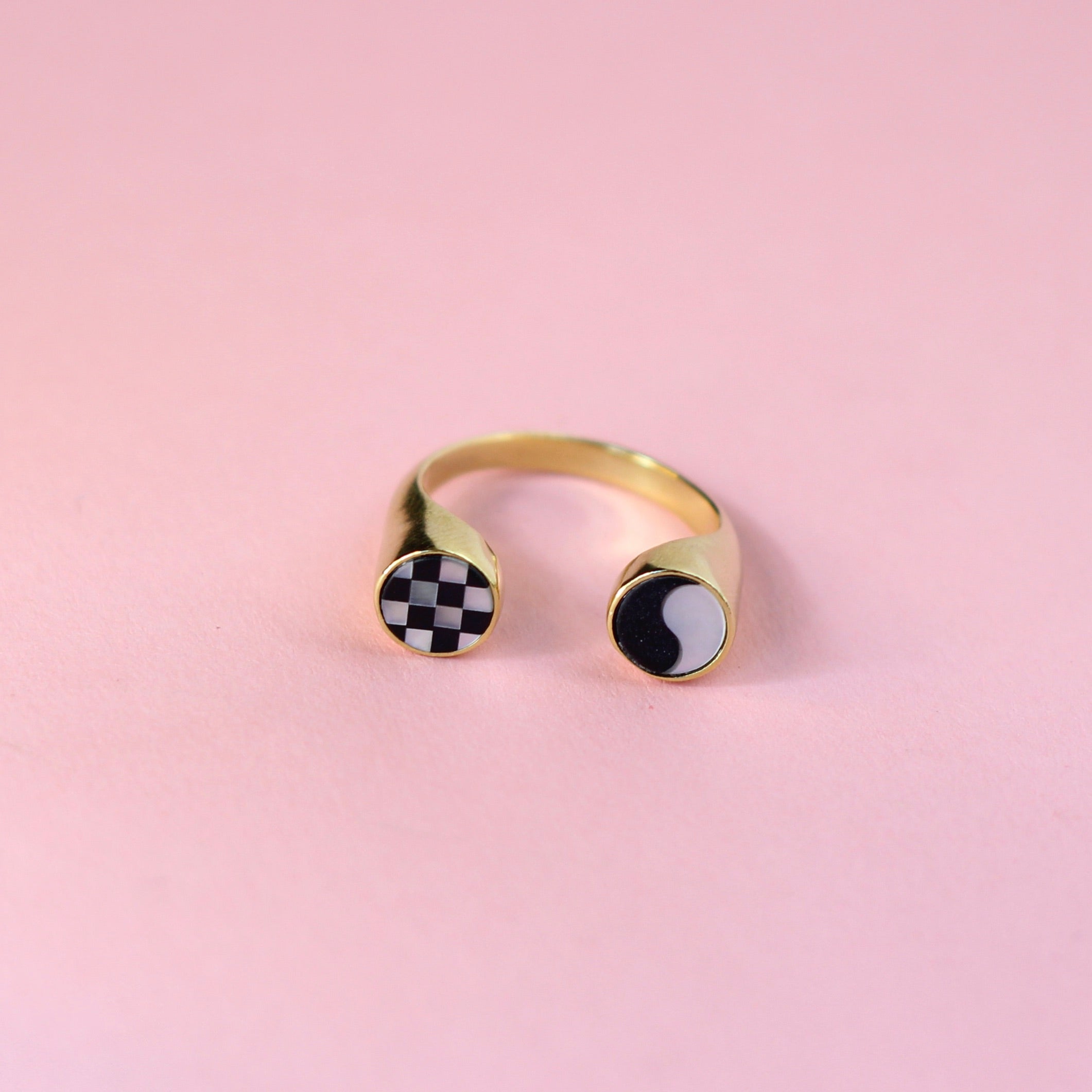 Gold toned spit shank ring with checkerboard and ying yang inlay designs