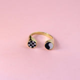 Gold toned spit shank ring with checkerboard and ying yang inlay designs