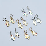 A photo of multiple pairs of cloud shaped huggie earrings in bronze and silver with different stone color options on a white background