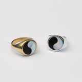 Two signet rings in bronze and silver with a round black and white ying yang inlay