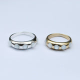 Silver and gold bands with white mother of pearl cabochon stones