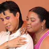 Two people wearing a selection of inlay jewelry