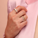 Three rings, one with colorful confetti bands, displayed against a light background.