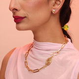 Person wearing bronze paperclip chain necklace with a spiral clasp