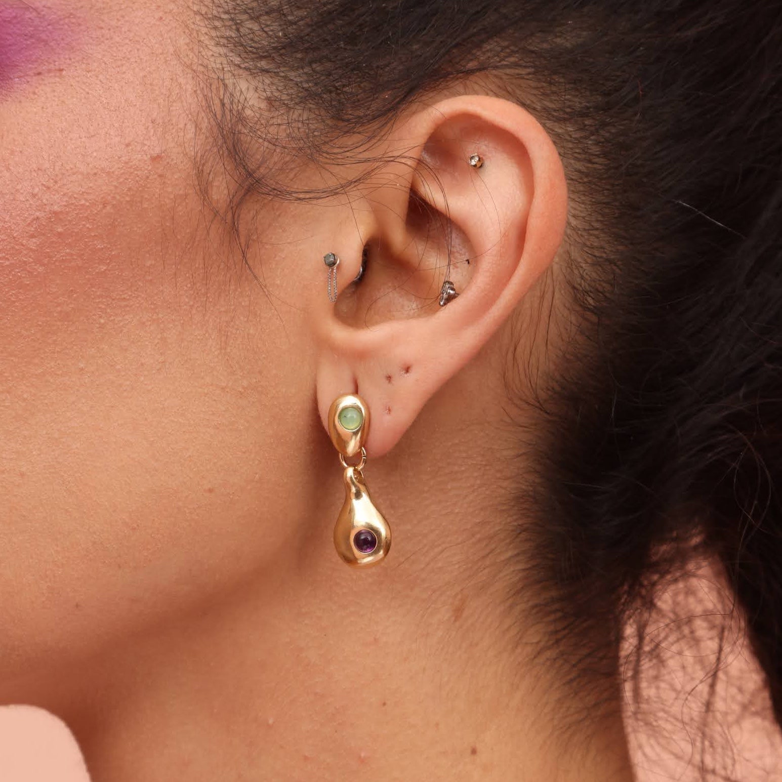 Gold colored bronze droplet earring shaped like a teardrop with purple amethyst and teal chrysoprase