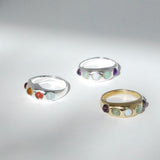 Three rings with colorful confetti bands, displayed against a light background.