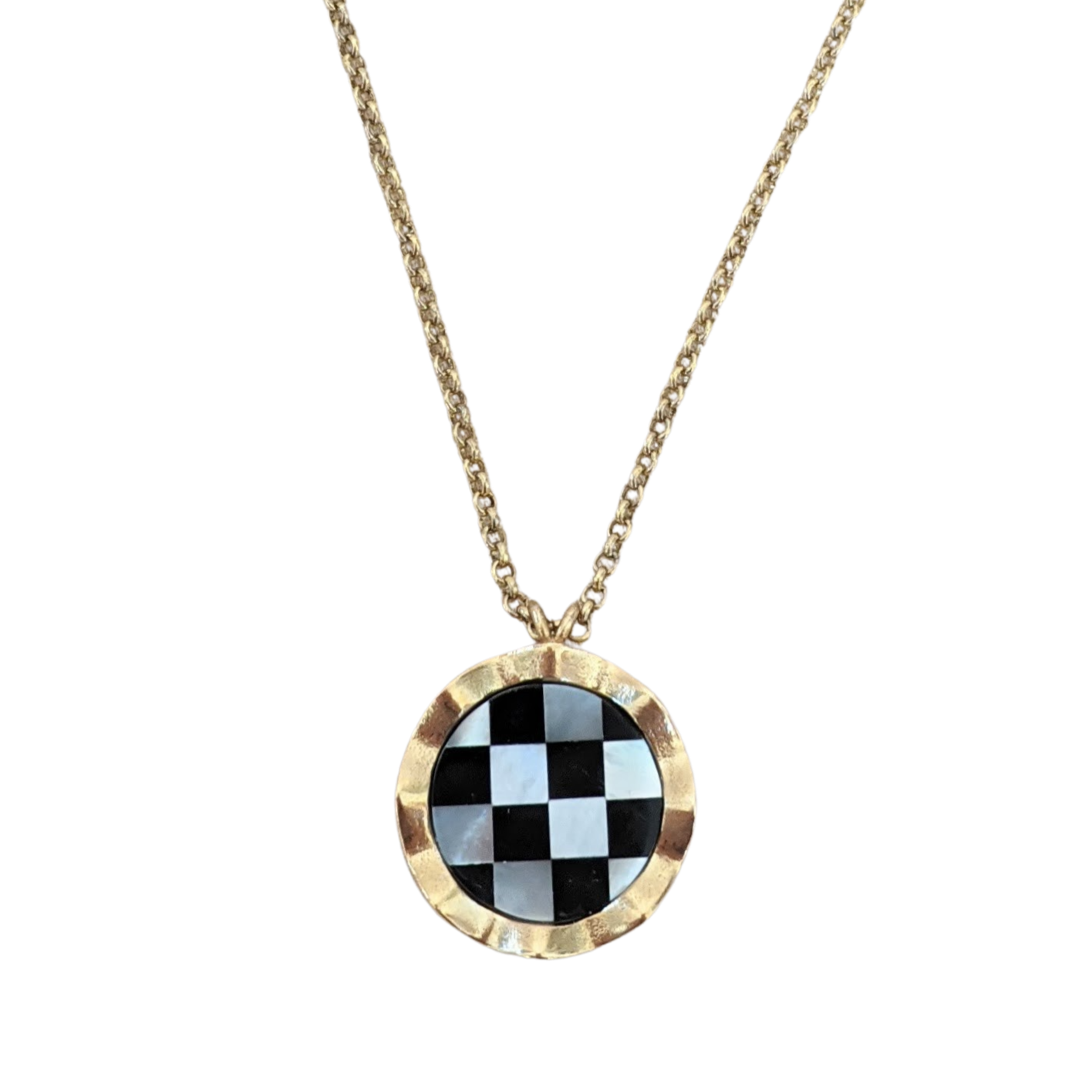 A close up of a checkerboard pendant with a gold border