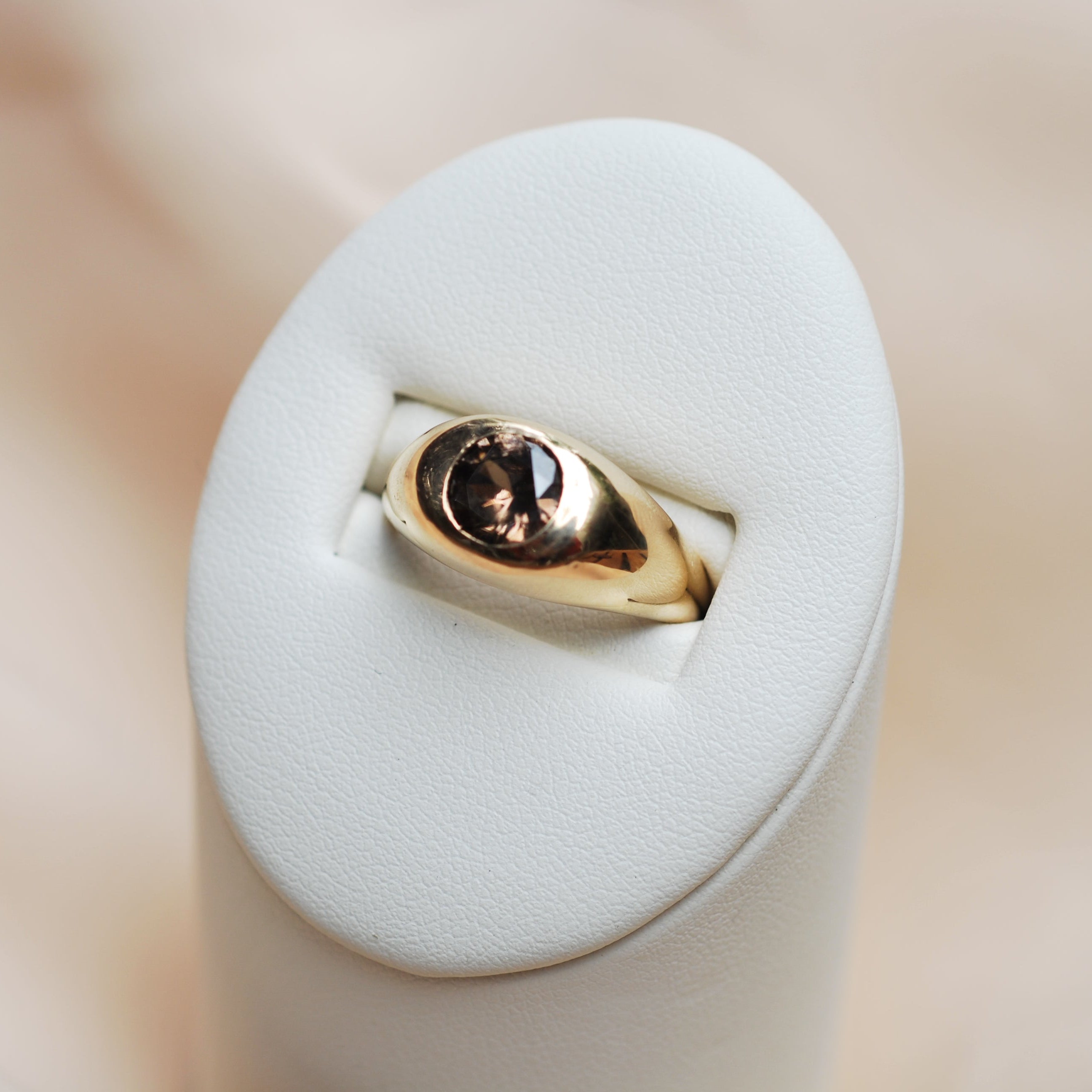 10k yellow gold organic ring with a champagne colored zircon stone flush set in the center