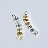 Long bronze and silver mixed metal huggie earrings made of coral shaped charms