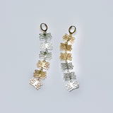Dangly mixed metal earrings made of coral shaped charms 