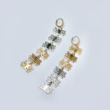 Bronze and silver mixed metal plant earrings with huggie hoops