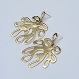 Bronze coral shaped earrings on a light gray background