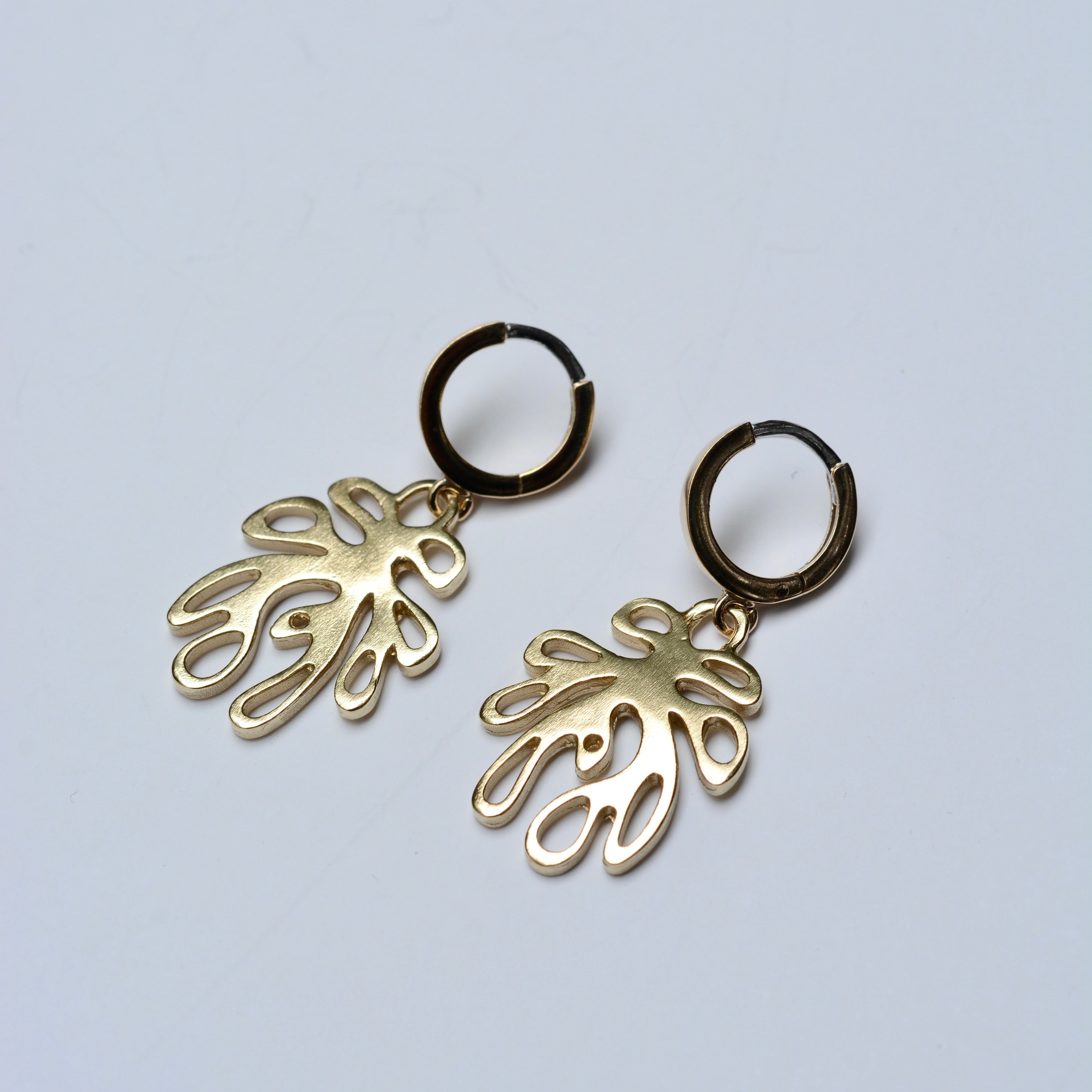 Bronze leaf shaped earrings with huggie hoops