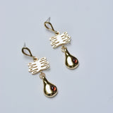 Bronze earrings with plant shaped charm and droplet featuring red garnet 