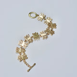 Bronze bracelet with unique design on a light gray background