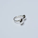 Silver ring on a light gray background