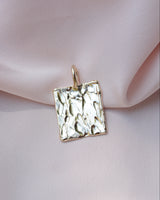 Gold rectangular pendant with organic bark like texture