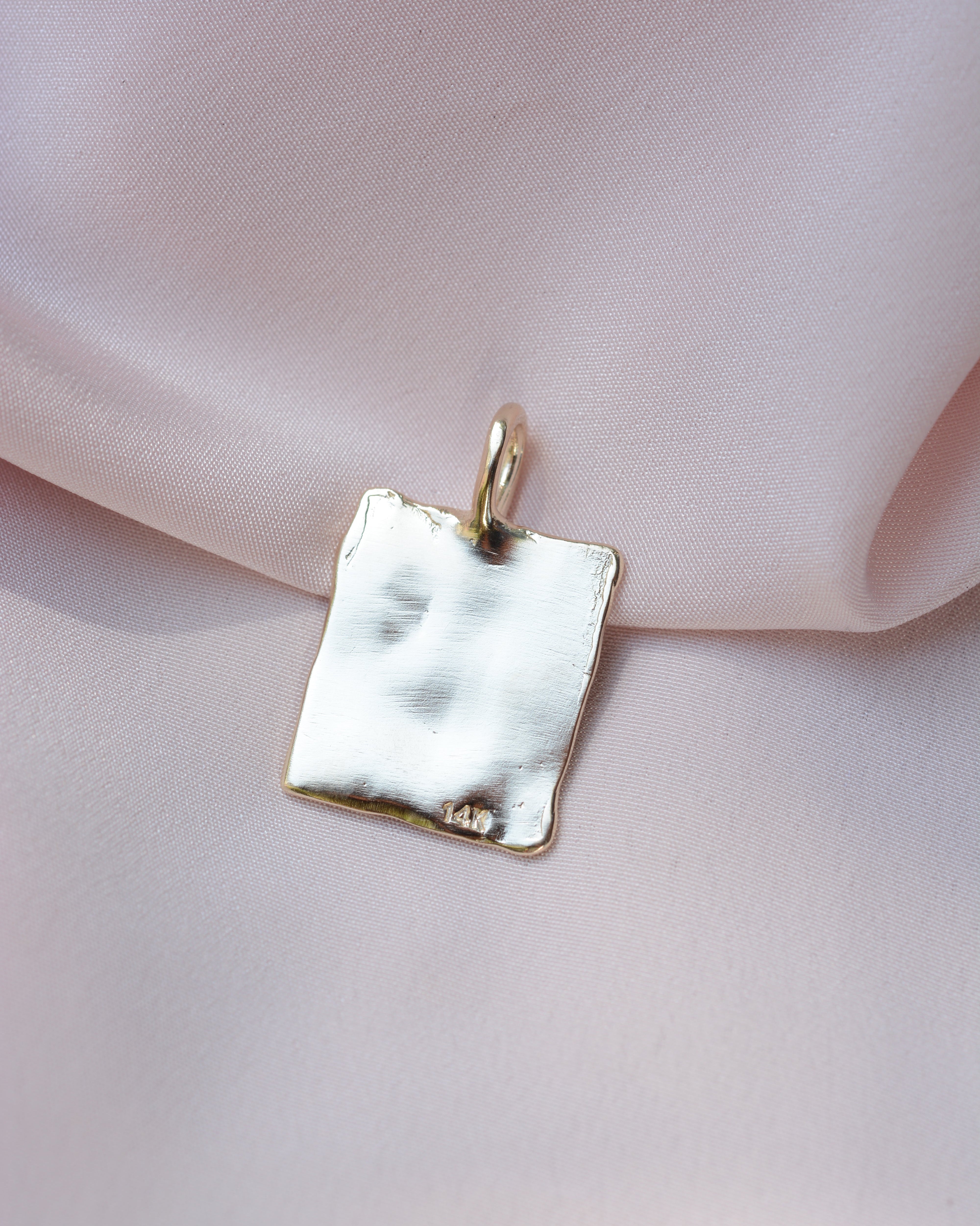Back of a rectangular pendant with 14k stamp