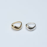 Two thick bronze and silver wavy rings 