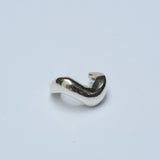 Silver wavy ear cuff on white background