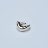 Silver ear cuff on a white background
