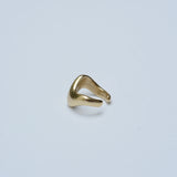 Bronze wavy ear cuff on grey background