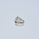 Silver ear cuff on grey background