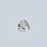 Silver organic ear cuff on white background