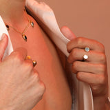 Person wearing a split shank ring with black and white stones