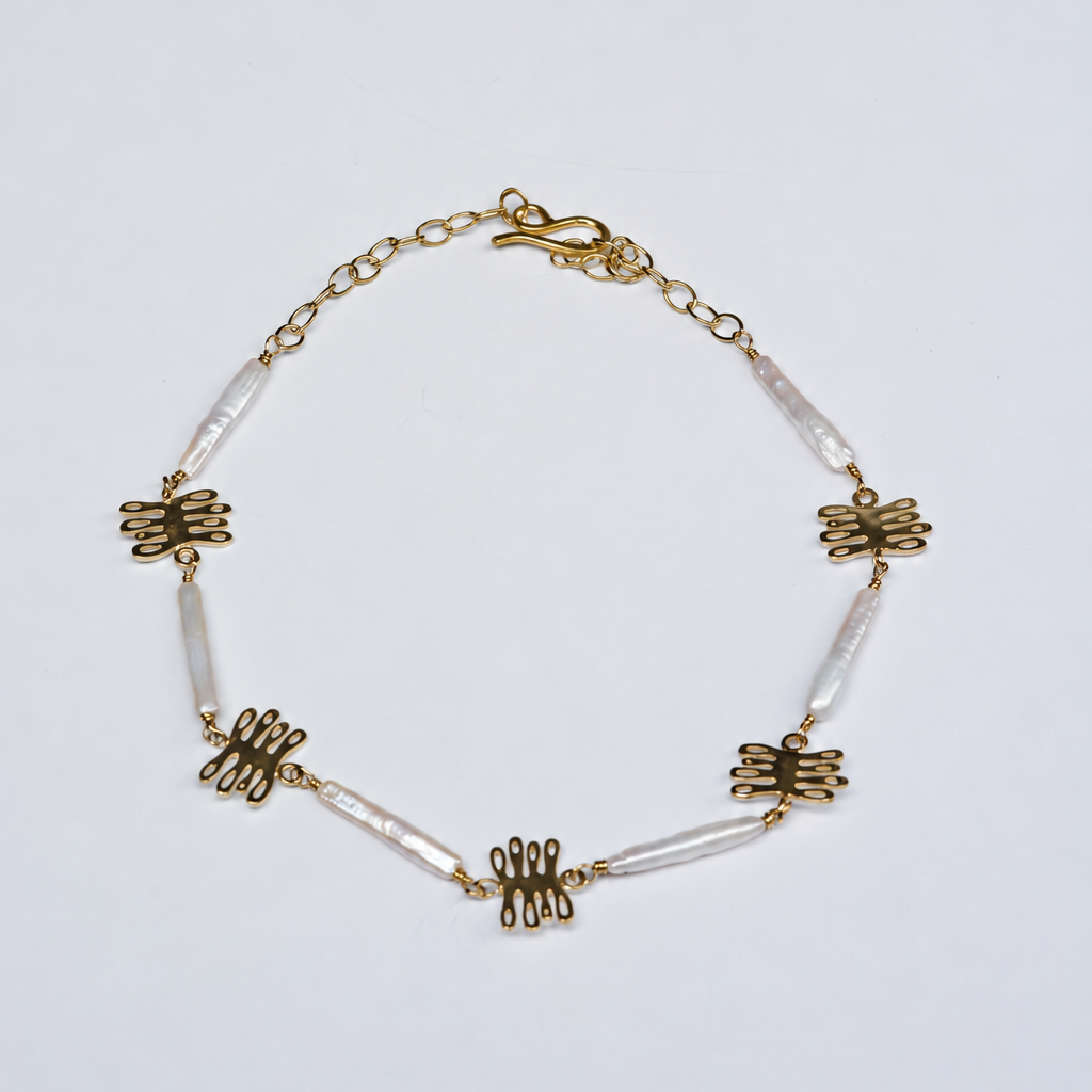 Bronze and pearl necklace with kelp shaped charm and unique, long pearls