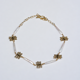 Bronze and pearl necklace with kelp shaped charm and unique, long pearls